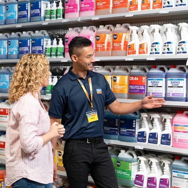 Clark Rubber team member assisting a retail business customer in-store with commercial cleaning products.