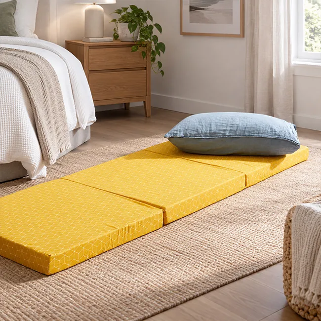 Single tri fold mattress set up in compact guest bedroom