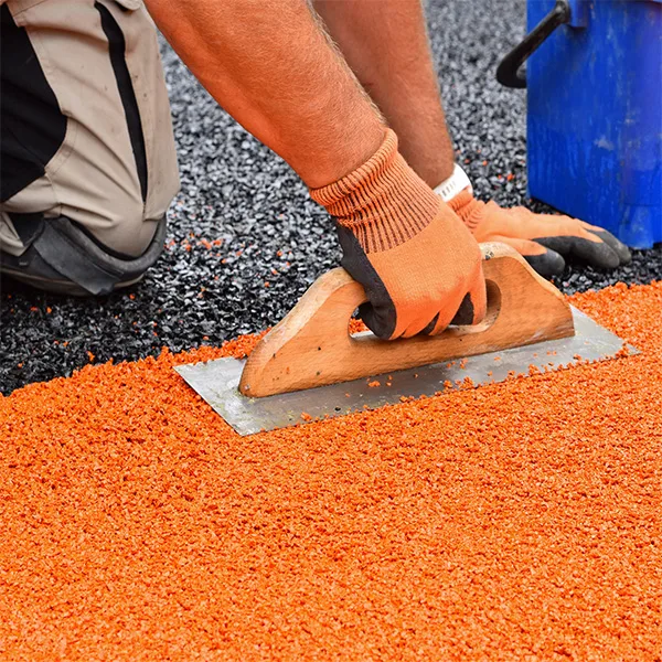 Wet pour recycled rubber surface installed in an outdoor pathway area