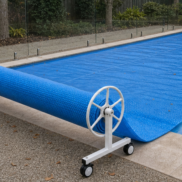 Swimming pool prepared for winter with fitted pool cover and clean outdoor area